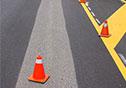 highway painting with orange cones