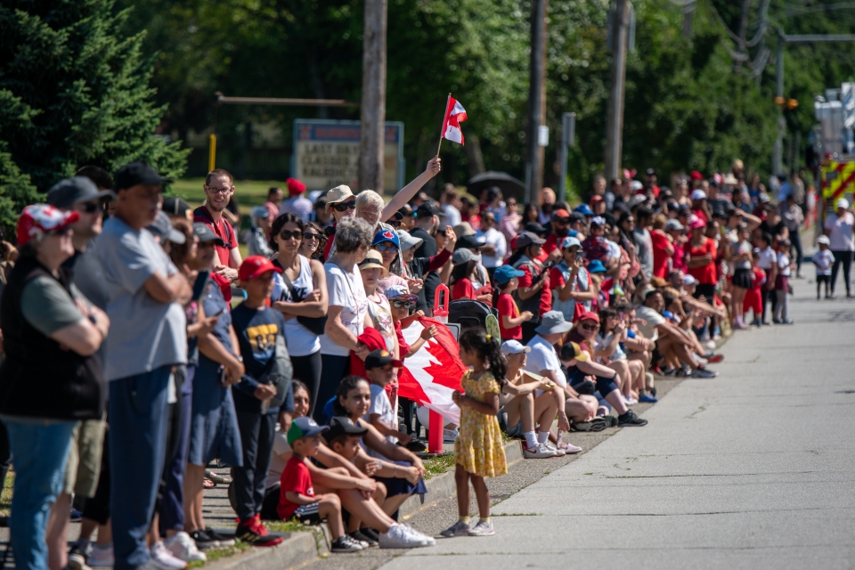 Crowds line up along 112 Street in North Delta for the Canada Day Parade.