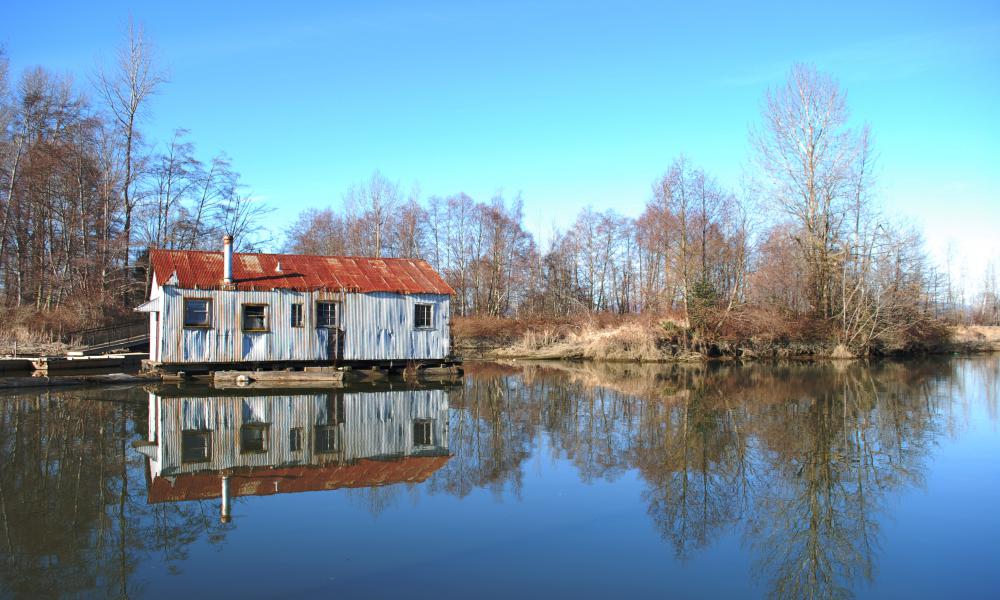 old house on the edge of a lake