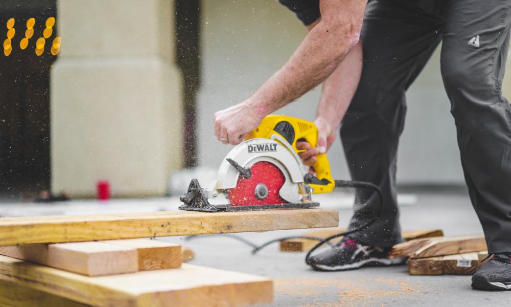 construction worker using a power saw