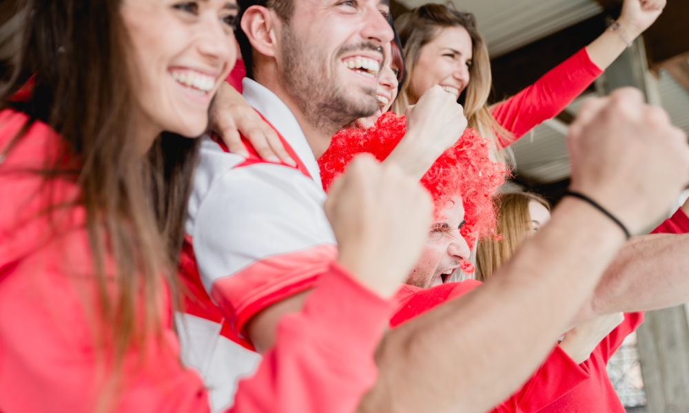 Canadian soccer supporters cheer at the Community Soccer Fan Zone