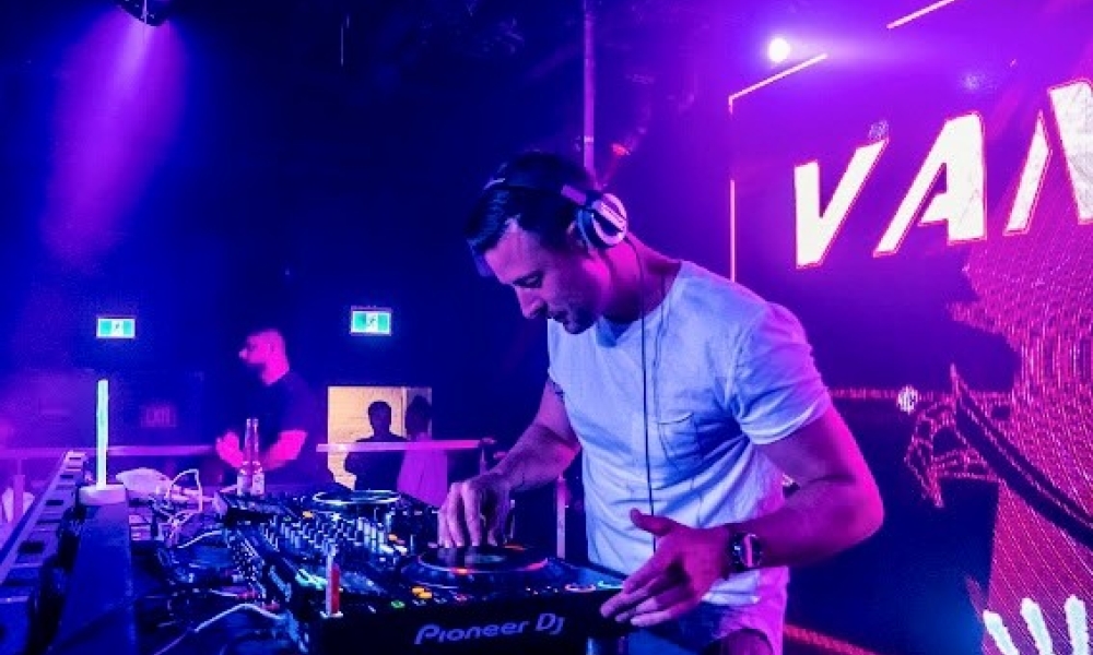 DJ playing purple background