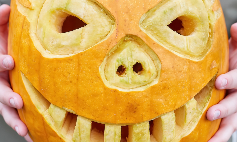 A jack-o-lantern is carved for the Great Pumpkin Carve!