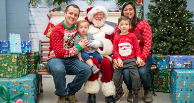A family sits with Santa Clause at North Delta Recreation Centre. 