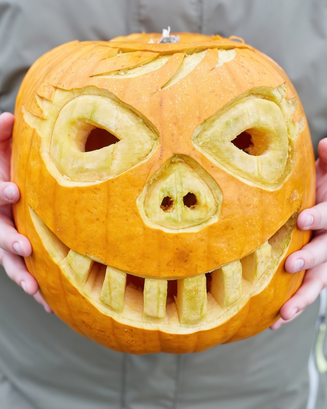 A jack-o-lantern is carved for the Great Pumpkin Carve!