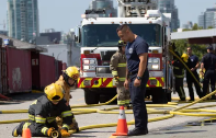 Firefighters working in front of a firetruck