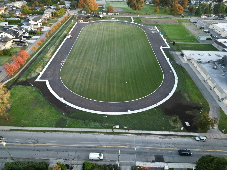 Overhead daytime drone shot of the newly asphalted track at Delta Secondary School.
