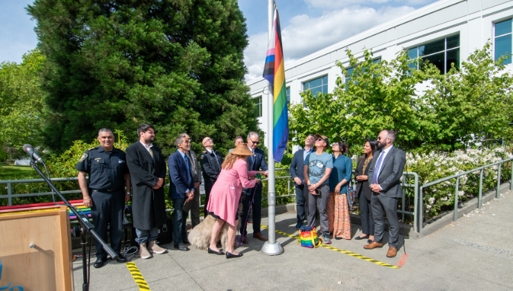 City officials raising pride flag