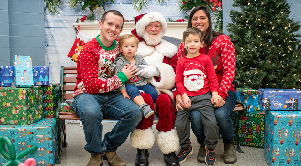 A family sits with Santa Clause at North Delta Recreation Centre.