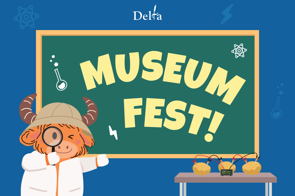 The Yak stands in front of a chalk boards that says MUSEUM FEST on it. 