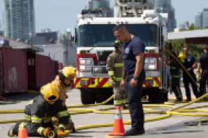 Firefighters working in front of a firetruck