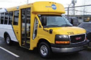 Yellow and white bus with HandyDart logo