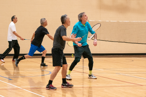 a group plays drop-in badminton after paying the updated rates for adult single admission in the 2026 fees and charges bylaw updates